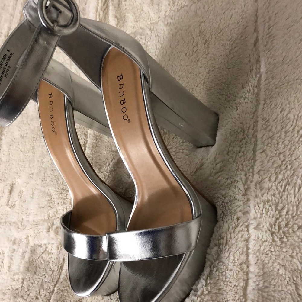 Silver pumps.